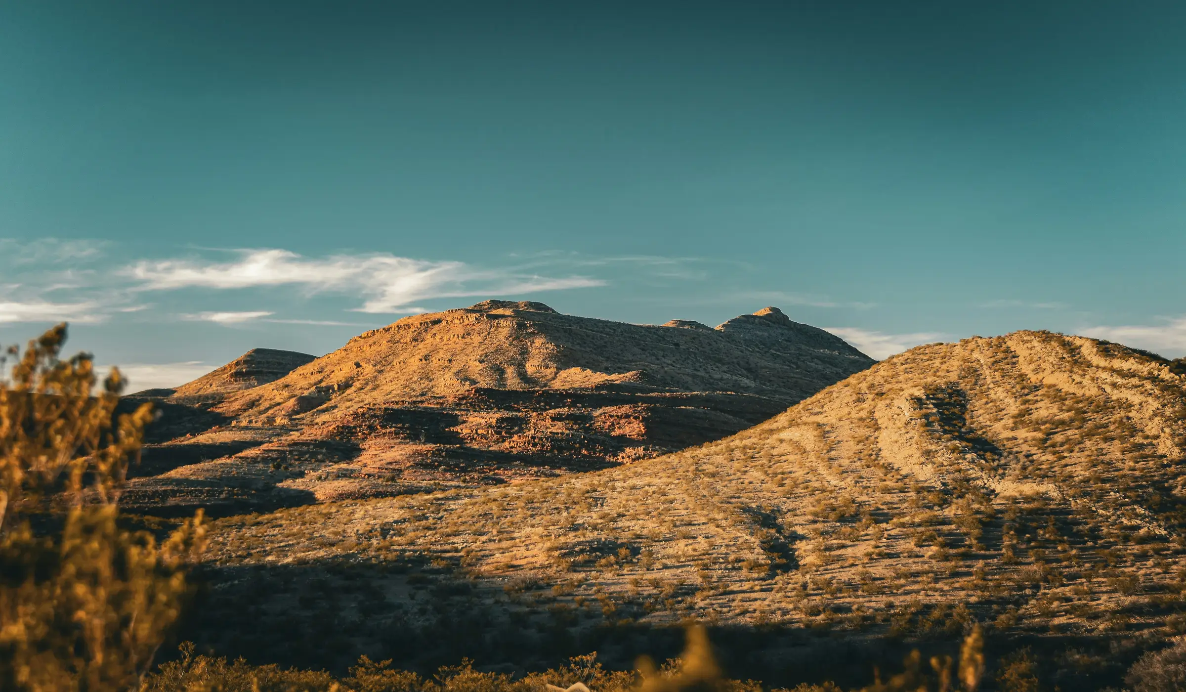 Open high-desert hills at sunset near San Miguel, NM